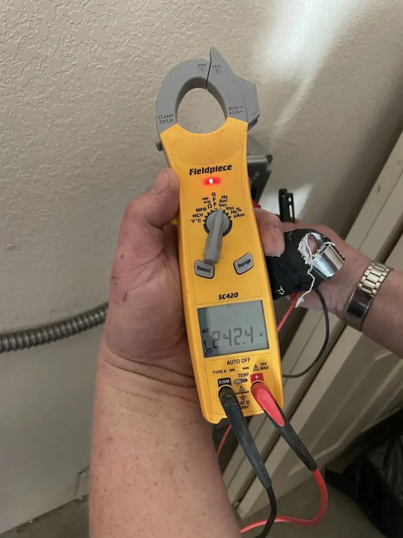 Voltage testing with clamp meter during Electrical Installation Services in Waunakee